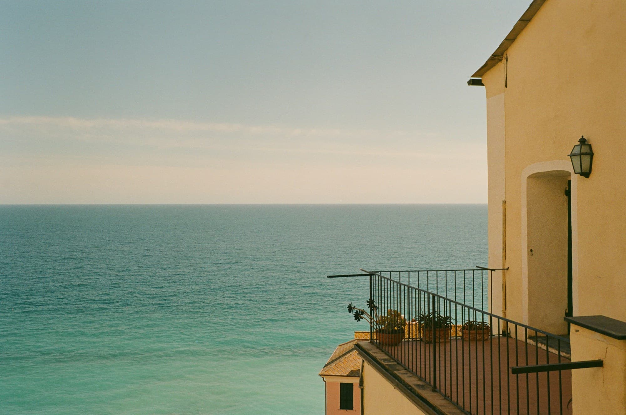 Balcony terrace above a calm turquoise sea