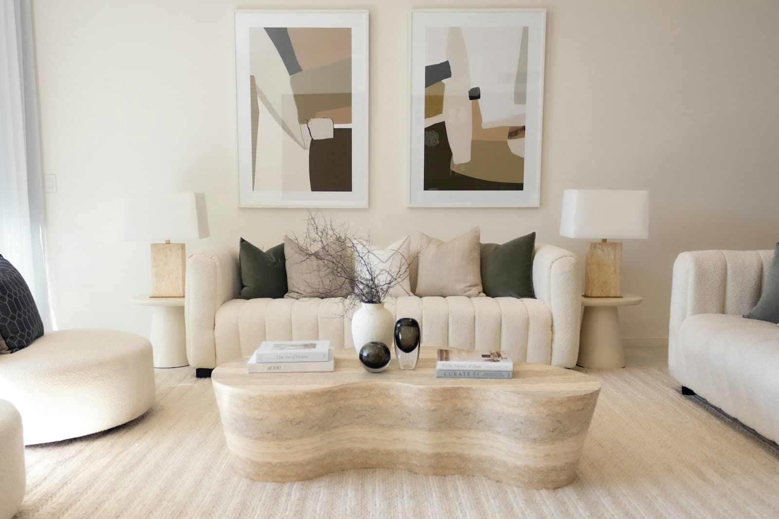 Elegant cream living room with a travertine table