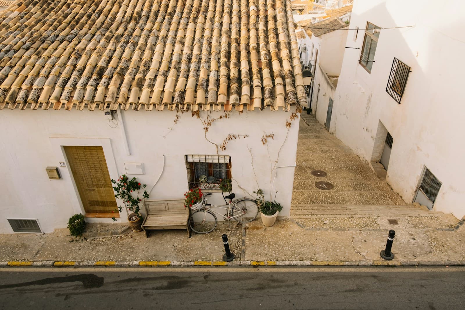 Whitewashed house with a wooden door in an old town